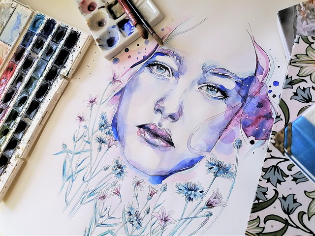 child painting watercolor landscape during online art lesson