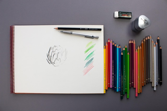 child drawing with colorful pencils and notebook in bright study corner